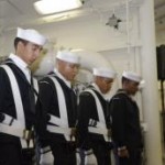 Permalink to At sea, USS Arlington remembers September 11 USS Arlington's (LPD 24) color guard bows their heads as the names are read of the 184 victims who perished in the crash at the Pentagon on September 11, 2001. Arlington held a 9/11 remembrance ceremony held in the Main Vehicle Stowage area while the ship operates in the Virginia Capes Operating Area. (U.S. Navy photo by Hospital Corpsman 2nd Class Brian Usler)