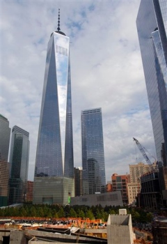 This Oct. 18, 2014, file photo shows One World Trade Center in the background, as people gather for a groundbreaking  at the site of the St. Nicholas National Shrine, in New York.Craig Ruttle, AP file