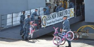 USS NEW YORK crew receives new children’s bikes assembled by 9/11 Tribute Center volunteers at the 9/11 Day of Service and Remembrance event.