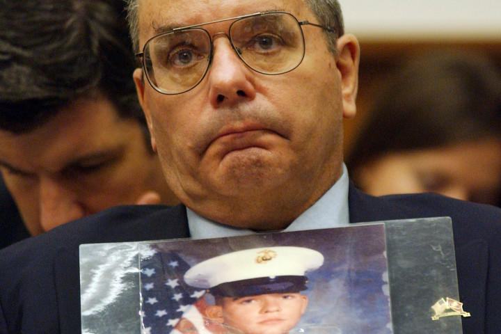 Al Regenhard holds a photo of his son Christian Michael Regenhard, who died on 9/11, during a House committee meeting about the 9/11 Commission's recommendations.Photo: UPI