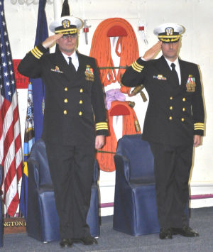 U.S. Navy Cmdr. Darren Nelson (left) was succeeded by Cmdr. Gregory Baker as commander of the USS Arlington during change-of-command ceremonies earlier this month. (Photo Jim Pebley)