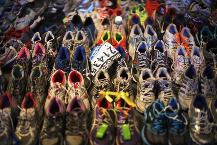 Running shoes left at the makeshift memorial following the 2013 Boston Marathon bombings, in an exhibit titled "Dear Boston: Messages from the Marathon Memorial" at the Boston Public Library  Credit: Reuters/Brian Snyder