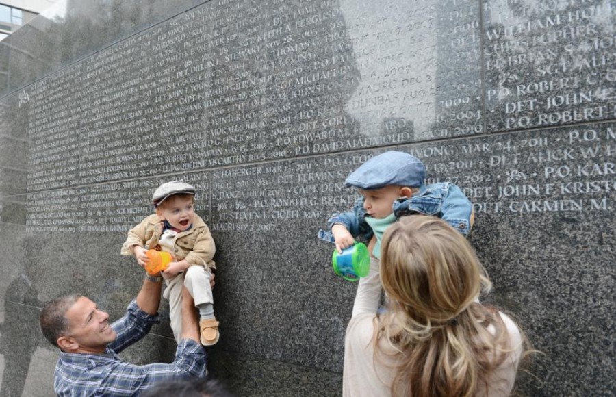  Two-year-old twins, Max and Owen Cioffi, are held up near their father's name Lt. Steven Cioffi. Susan Watts/New York Daily News
