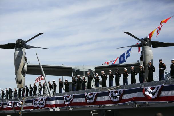 Crew members line the rails during a commissioning ceremony for the USS Somerset (AP Photo/ Joseph Kaczmarek)