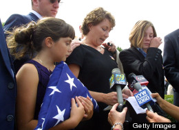 Ellen Saracini (center), with daughters Brielle (left) and Kirsten (right), following a 2001 funeral mass for her husband, Victor Saracini, a United Airlines Flight 175 pilot. (Photo: Tom Mihalek/AFP/Getty Images)