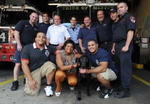 FF Carl Asaro's family and fellow FDNY members with the TSA dog who bears his name
