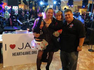 At a fundraiser at Adriana's, New Dorp, for 21-month-old Jake Schron, who needs a new heart, are from left, Courtney, mom Shannon and Mackenzie Schron and Massimo DiDonna, co-founder of the Carl V. Bini Memorial Foundation. Staten Island Advance
