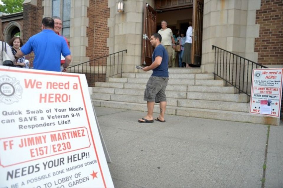 Jimmy N. Martinez hands out flyers encouraging people to become donors during a bone marrow drive for his father, Firefighter Jimmy Martinez, who suffers from multiple myeloma at Our Lady Queen of Peace Church in New Dorp.(Staten Island Advance/Bill Lyons)