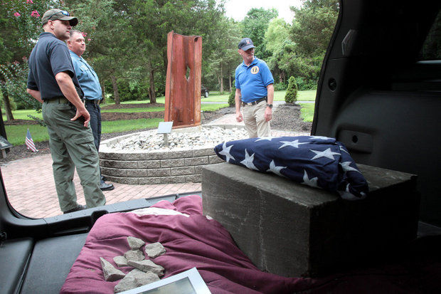 Lt. Jeff Ferry, Mantua Police Department, L, Chief Rodney Sawyer and Steven Saymon, retired Brooklawn PD, R, stand at the Place of Reflection in Chestnut Branch Park. (Photo by Tim Hawk/South Jersey Times) 
