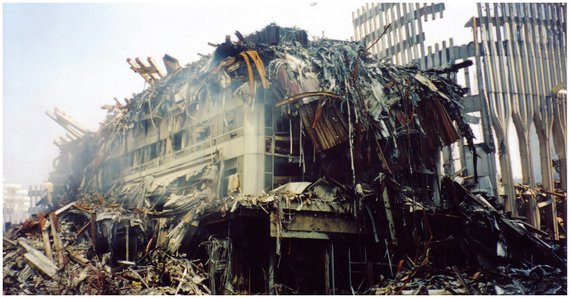 Photo of World Trade Center 3 with remains of WTC1 (left background) and WTC2 (right foreground) visible. Taken by me in September, 2001. (This photo is in the public domain on WikiCommons.) 