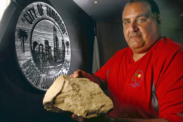 Michael Sargis displays a piece of shale from the field where hijacked UA Flight 93 crashed on Septermber 11, 2001. The rock, along with some soil, a limestone block from the Pentagon and a piece of steel from the World Trade Centers will be displayed as part of North Lauderdale's 9/11 memorial. (Mark Randall, Sun Sentinel)