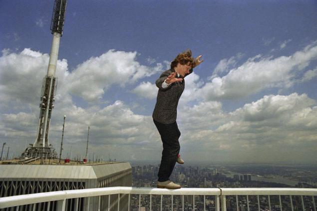 High wire artist Philippe Petit walks the railing atop New York’s World Trade Center, 1350 feet above Manhattan’s streets on July 14, 1986, during a break in a news conference held to announce his dare-devil plans for the rest of the year. Included in Petit’s future exploits is a high wire walk over the Grand Canyon next spring. Richard Drew AP