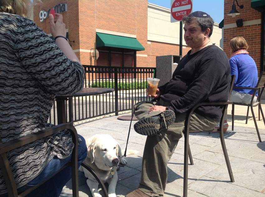 World Trade Center first responder Philip Kirschner of Naperville with fiancée Jennifer Brower and service dog Jumper in Naperville. Denise Crosby, Sun-Times Media