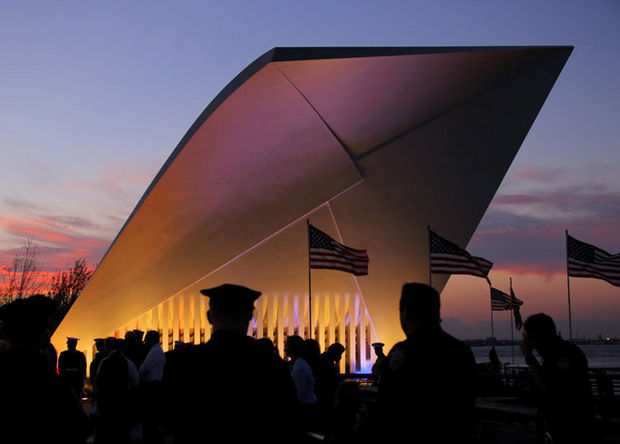 The sun sets behind the 9-11 Postcards Memorial on the St. George Esplanade during the annual September 11 memorial ceremony for Staten Island victims of the 2001 terrorist attacks in lower Manhattan. Thursday September 11, 2014. (Staten Island Advance/Anthony DePrimo)