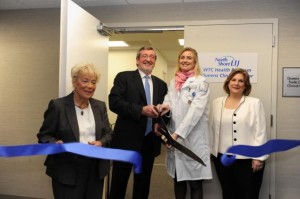 Queens Borough President Helen Marshall (l.), North Shore-LIJ President Michael Dowling, Queens WTC Health Program Director Dr. Jacqueline Moline and Retured NYPD officer Lorelei Sander cuts the ribbon during opening ceremony on Monday of the Queens World Trade Center Health Program at North Shore-LIJ Health System in Rego Park.