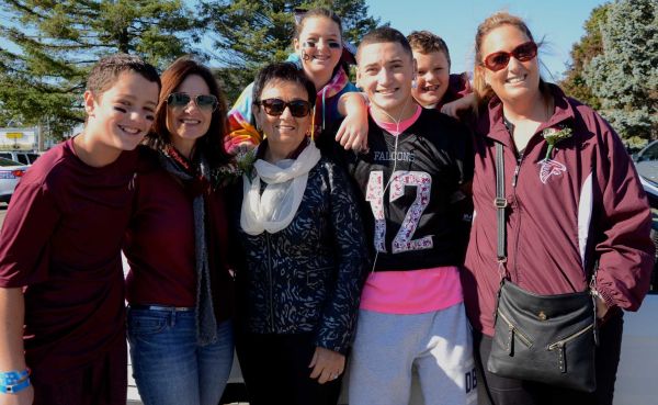 Deer Park High School honored Rosalie Downey, 75, center, as the grand marshal at the homecoming day parade on Saturday, Oct. 25, 2014. Downey is the wife of fallen FDNY deputy chief of special operations Ray Downey, who died while trying to save civilians during 9/11. From left: Raymond Ugalde, Marie Tortorici, Nina Ugalde, Peter Tortorici, Brian Ugalde and Kathy Ugalde. (Credit: Amy Onorato)