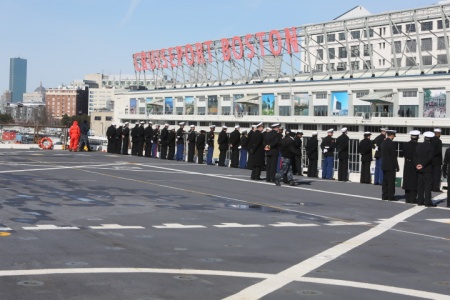 Marines and sailors aboard the USS Arlington ‘man the rails’ as the ship approaches the Black Falcon terminal in South Boston, March 13, 2015.