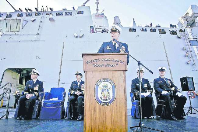 Capt. Jon C. Kreitz, outgoing commanding officer amphibious transport dock ship USS New York (LPD 21) gives welcome remarks during change of command ceremony aboard New York. Photo by MC2 Cyrus Roson