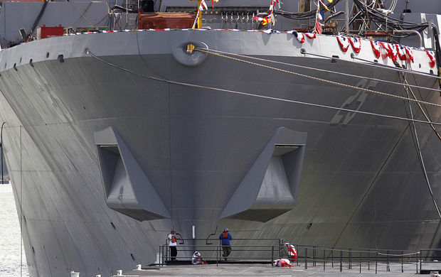 Workers are seen in front of the hull of the USS Somerset as they prepare for the commissioning of the USS Somerset at the Huntington Ingalls Industries shipyard Shipyard in Avondale, La., Wednesday, July 25, 2012. photo nola.com