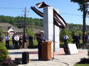 Former Warren Township Fire Chief Tim McGowan speaks at the dedication of the new 911 Heroes Memorial Monument on Monday, May 27.