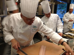 Chef Lars Kronmark teaches veterans how to remove the skin of a fish; part of a four-day “boot camp” at Napa’s Culinary Institute of America where injured veterans and their spouses learn healthy cooking tips. (Mina Kim/KQED)