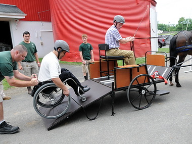 A ramp that unfolds at the back of Lord Stirling stable's therapeutic driving carriage makes it easy for wheelchair-bound people, such as freeholder Patrick Scaglione, to go in and out of the vehicle Nancy Jaffer/The Star-Ledger