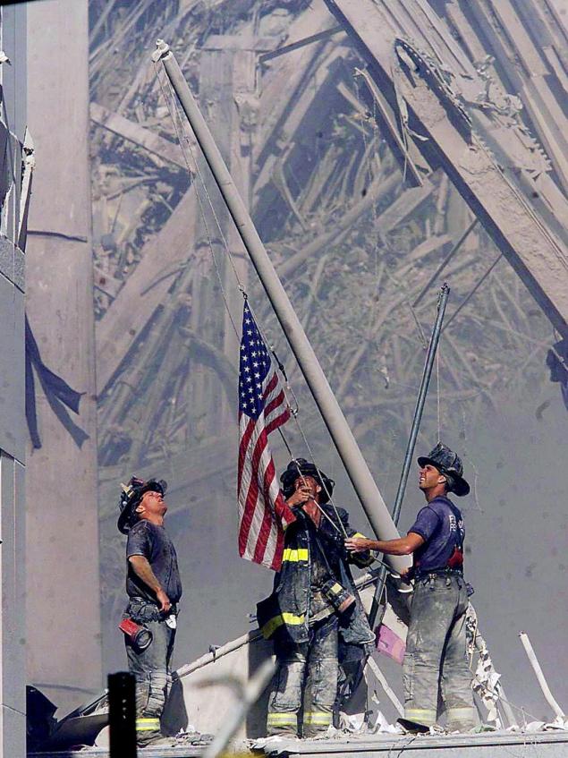 Firefighters raise a flag at the World Trade Center in New York. Photo: Thomas E. Franklin, Associated Press