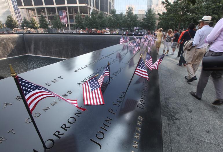 Flags line one of the World Trade Centers' National 9/11 Memorial pools during the 12th anniversary of the attacks in 2013. Reuters