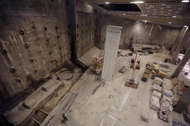 The slurry wall (left), part of the World Trade Center's original foundation, and the last column removed from the WTC site, (center, covered in a protective wrap). Mary Altaffer/AP