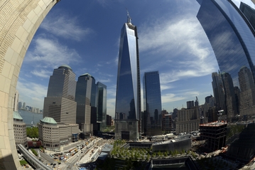 AFP/Getty Images The final section of the 408-foot mast was installed Friday atop One World Trade Center. Slide show
