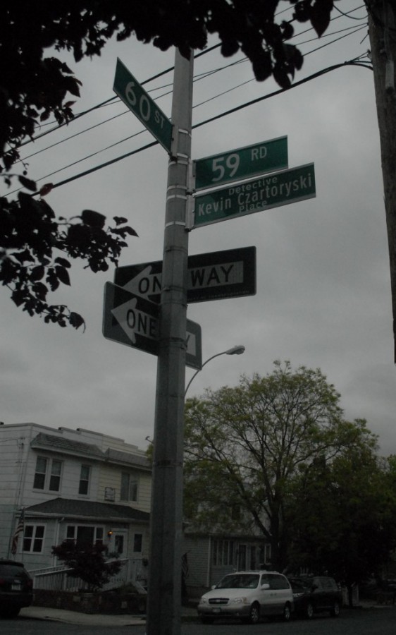Maspeth native and 9/11 responder Det. Kevin Czartoryski will always be remembered. His name now has a permanent place where 60th Street and 59th Road meet in Maspeth. Forum Newsgroup Photo by Jeremiah Dobruck
