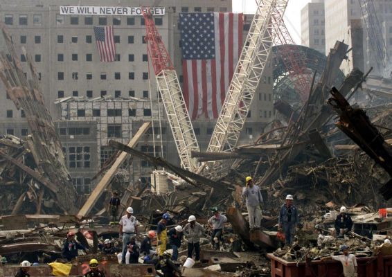 Rescue workers search through the wreckage of the World Trade Center in Manhattan. (September 24, 2001) Photo by Ted Warren
